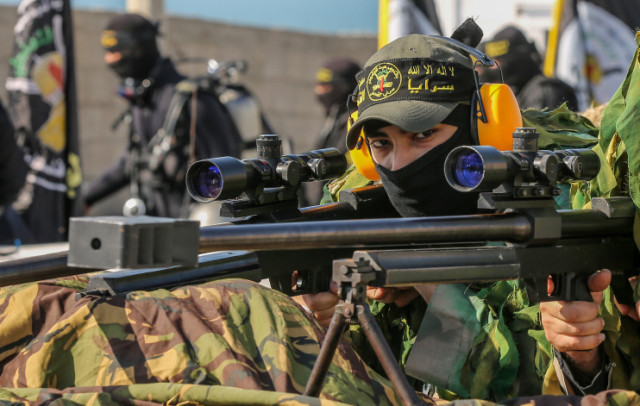 Members of the Saraya al-Quds Brigades, the armed wing of the Palestinian Islamic Jihad movement, take part in a military parade in Al-Shati refugee camp, west of Gaza City, June 24, 2022. (Photo: Attia Muhammed/Flash90)