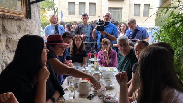 British ex-pats and tourists gather at the Kumkum Tea House in Jerusalem to watch the livestream of Queen Elizabeth's funeral together. (Photo: All Israel News)