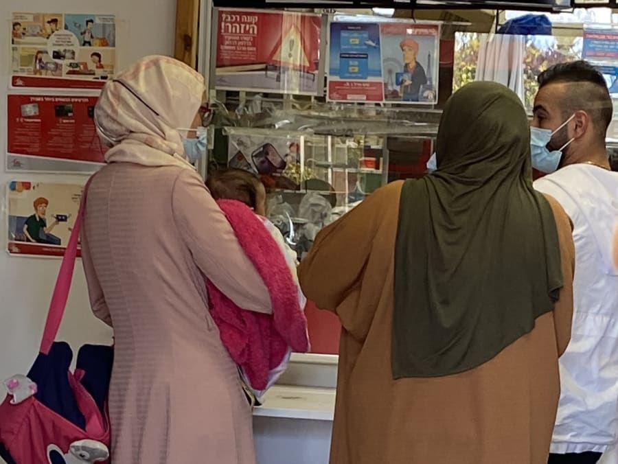 Arab women at the post office in a Jewish settlement in Samaria (Photo: Jonathan Feldstein)