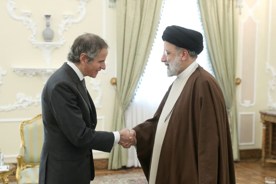 Iranian President Ebrahim Raisi shakes hands with International Atomic Energy Agency (IAEA) Director General Rafael Grossi in Tehran, Iran, Mar. 4, 2023. (Photo:Iran's President Website/WANA/Handout via REUTERS)