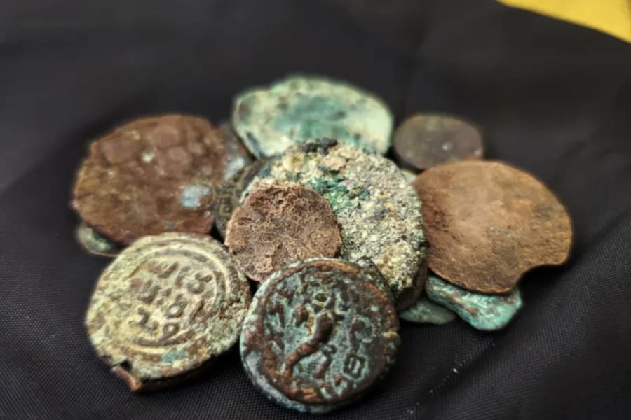 Ancient coins, including one from the reign of the last Jewish king, Antigonus II Mattathias, that have been recovered from an alleged thief in East Jerusalem.
(Photo: Israel Antiquities Authority)
