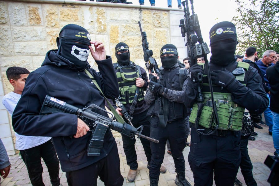 Palestinian gunmen hold their weapons after an Israeli military raid in Tulkarem, in the West Bank, December 17, 2023. (Photo by Nasser Ishtayeh/Flash90)