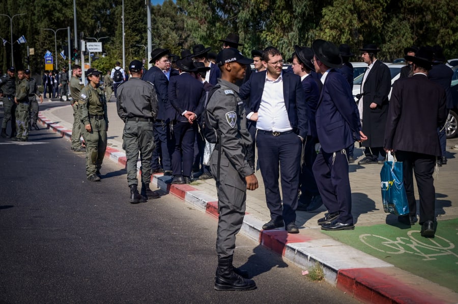 Ultra-Orthodox Jews clash with police during a protest against the drafting of ultra-Orthodox Jews to the Israeli army, outside the IDF Recruitment Center at Tel Hashomer, in central Israel, October 31, 2024. (Photo: Avshalom Sassoni/Flash90)