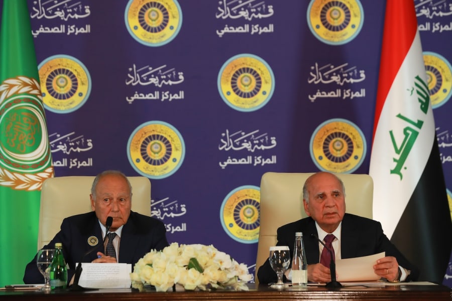 Arab League Secretary-General Ahmed Aboul Gheit (left) and Iraqi Foreign Minister Fuad Hussein speak at a press conference following the 34th Arab League Summit in Baghdad, May 17, 2025. (Photo: Ameer Al Mohammedaw / dpa Pool)