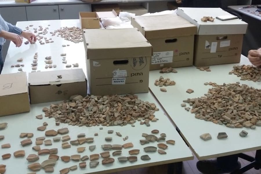 Sorting artifacts collected from the Temple Mount in Jerusalem (Photo: Temple Mount Sifting Project)