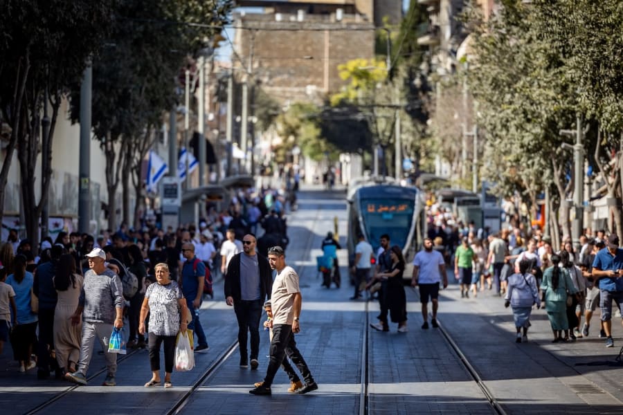 People walk on Jaffa street in central Jerusalem as they visit the city during the Jewish holiday of Sukkot, October 21, 2024. (Photo: Yonatan Sindel/Flash90)