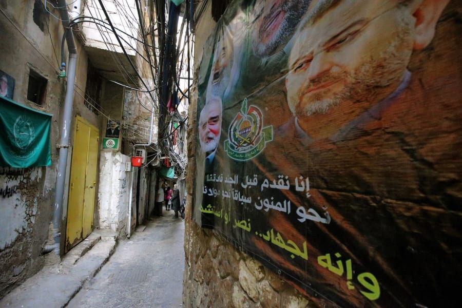 A huge poster showing Palestinian Hamas leaders, assassinated by Israel, decorate a narrow alley at a Palestinian refugee camp in Beirut, May 20, 2025. (Photo: Marwan Naamani/ZUMA Press Wire via Reuters)