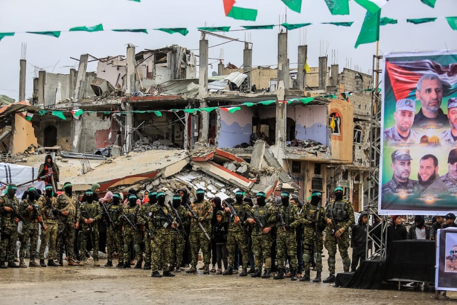 Members of the Al-Qassam Brigades hand over of Israeli hostages to the Red Cross, as part of the ceasefire agreement between Israel and Hamas, in Rafah, February 22, 2025. (Photo: Abed Rahim Khatib/Flash90)