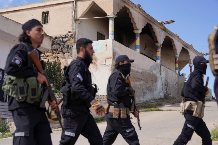 Members of Syrian security forces patrol after being deployed in the village of Al-Soura al-Kubra, following clashes between Sunni Islamist militants and Druze fighters, in Sweida province, Syria, May 2, 2025. (Photo: REUTERS/Karam Al-Masri)