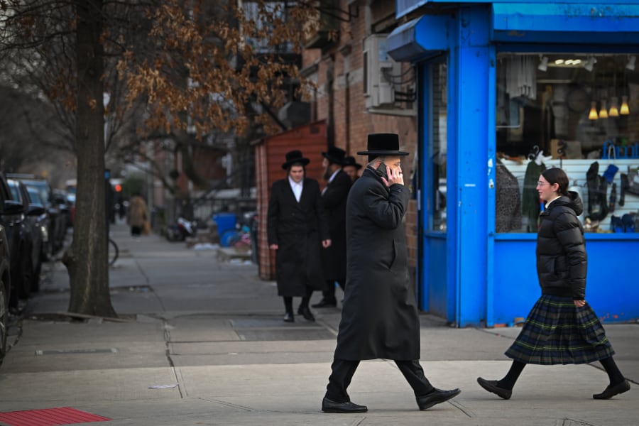 Ultra-Orthodox Jews seen walking on a street in Borough Park neighborhood in the southwestern borough of Brooklyn, New York City, January 12, 2025. (Photo: Arie Leib Abrams/Flash90)