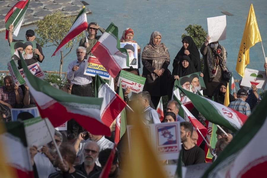 Iranian people hold portraits of Iran's Supreme Leader, Ayatollah Ali Khamenei, and wave the country's flags during a rally to celebrate the ceasefire, which they believe is a victory over Israel in a 12-day war, in downtown Tehran, Iran, June 24, 2025. (Photo: Morteza Nikoubazl/NurPhoto)