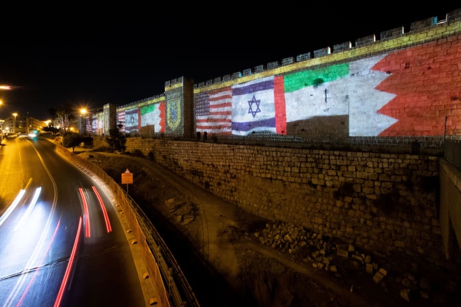 The flags of the U.S., United Arab Emirates, Israel and Bahrain are screened on the walls of Jerusalem's Old City, September 15, 2020. (Photo: Yonatan Sindel/Flash90)