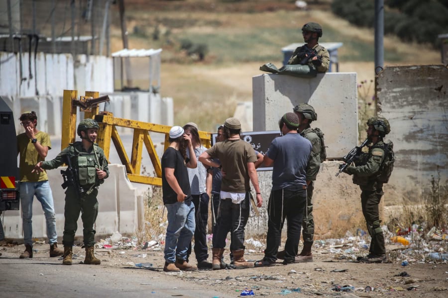 Israeli soldiers guard during a protest of Jewish settlers at the Beit Furik checkpoint, east of Nablus, in the West Bank, May 9, 2025. Photo by Nasser Ishtayeh/Flash90