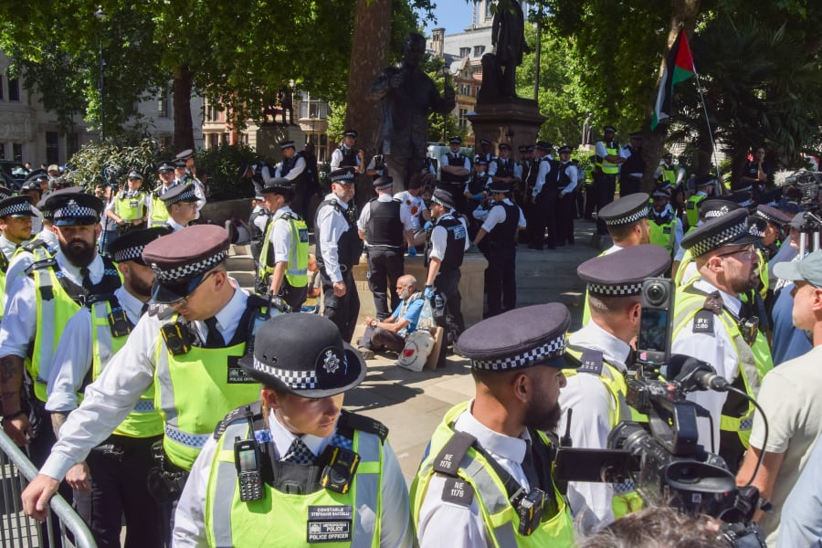 Police officers arrest protesters around the statue of Nelson Mandela in Parliament Square who were holding placards in support of Palestine Action, which has been banned under anti-terrorism laws, July 12 2025. Photo: Vuk Valcic via Reuters.