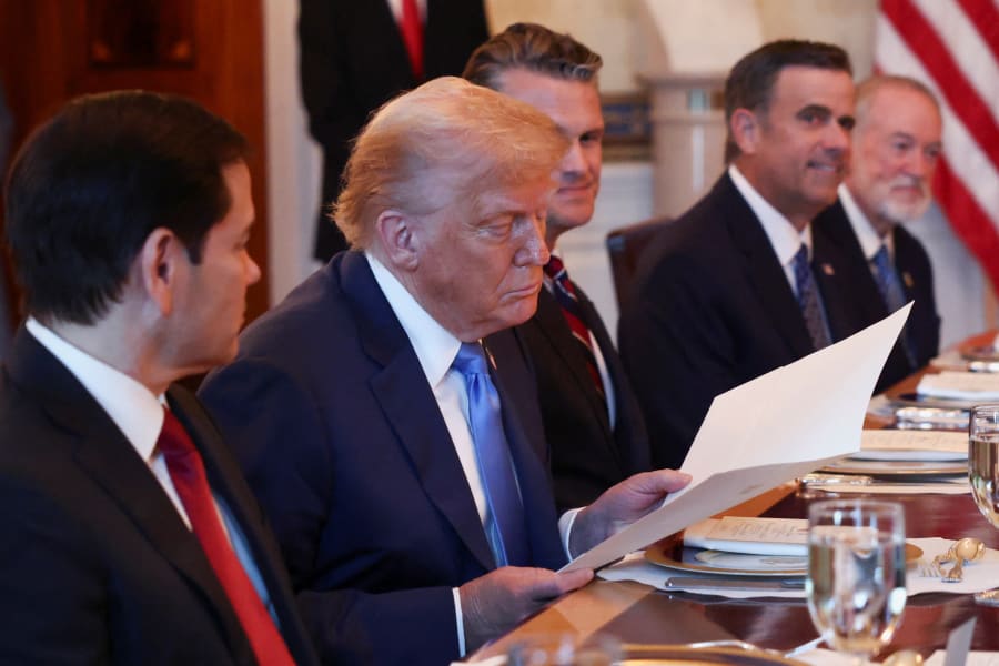 U.S. President Donald Trump looks at a nomination letter after Israeli Prime Minister Benjamin Netanyahu (not pictured) told him he nominated him for the Nobel Peace Prize, during a bilateral dinner, with U.S. Defense Secretary Pete Hegseth and U.S. Secretary of State Marco Rubio in attendance, at the White House in Washington, D.C., U.S., July 7, 2025. Photo: REUTERS