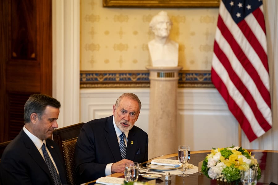 John Ratcliffe, director of the Central Intelligence Agency (CIA), left, and Mike Huckabee, US ambassador to Israel, right, during a dinner with US President Donald Trump, not pictured, and Israeli Prime Minister Benjamin Netanyahu, not pictured Blue Room of the White House in Washington, DC, US, on Monday, July 7, 2025. Photo: Reuters