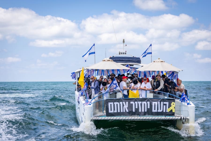 Family members of Israeli hostages held in Gaza seen on a protest flotilla sailing from Ashkelon toward the maritime border with the Gaza Strip, calling for the immediate release of the hostages, August 7, 2025. (Photo: Chaim Goldberg/Flash90)