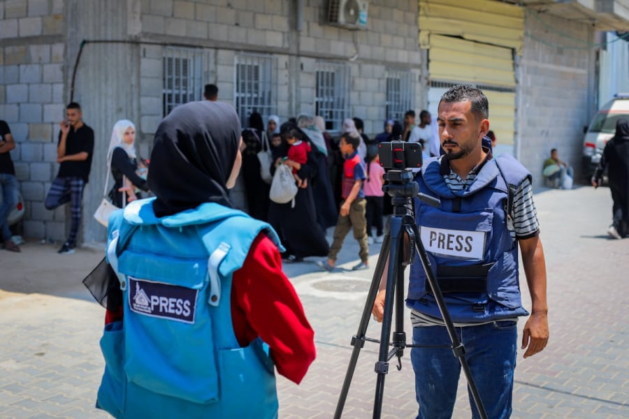 Illustrative - Palestinian journalists report on the war in central Gaza Strip, July 26, 2025. (Photo: Ali Hassan/Flash90)