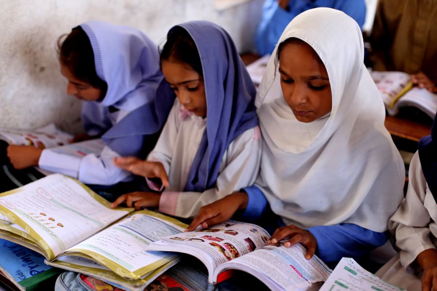 Illustrative: Students listen to their teacher during a lesson at the outstrike of Lahore, Pakistan, May 14, 2016. (Photo: Sutterstock)