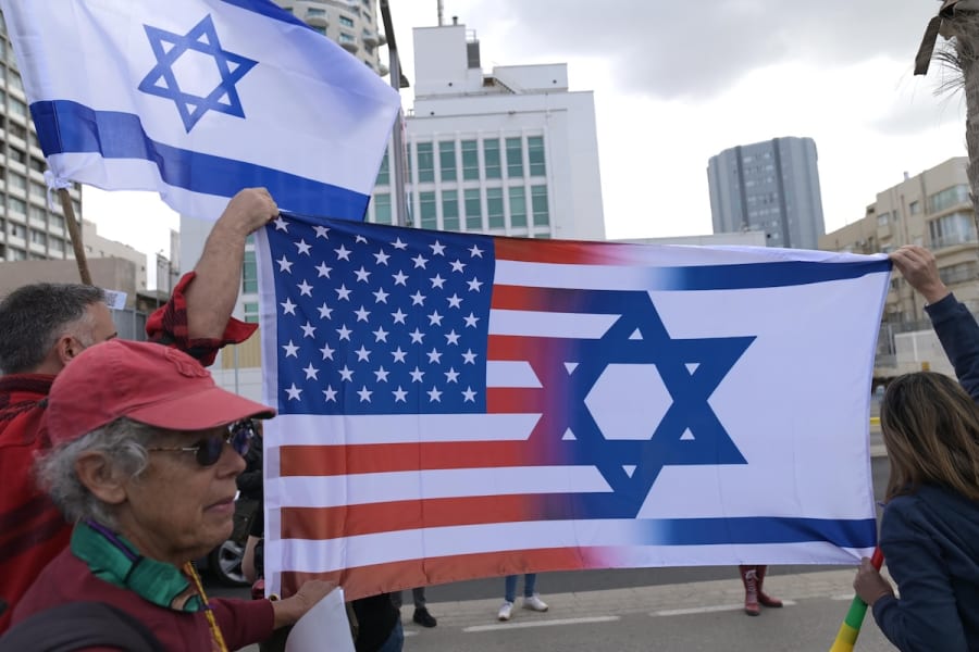 Israelis wave the Israeli and American flag as they held a demonstration outside the US consulate in Tel Aviv, March 7, 2023. (Photo: Tomer NeubergFlash90)