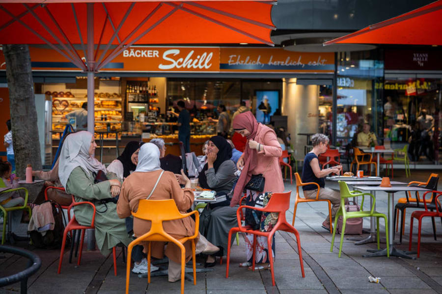 Illustrative: Muslim women sit at a fast food restaurant in Stuttgart, Germany. July 20, 2023. Photo by Nati Shohat/FLASH90