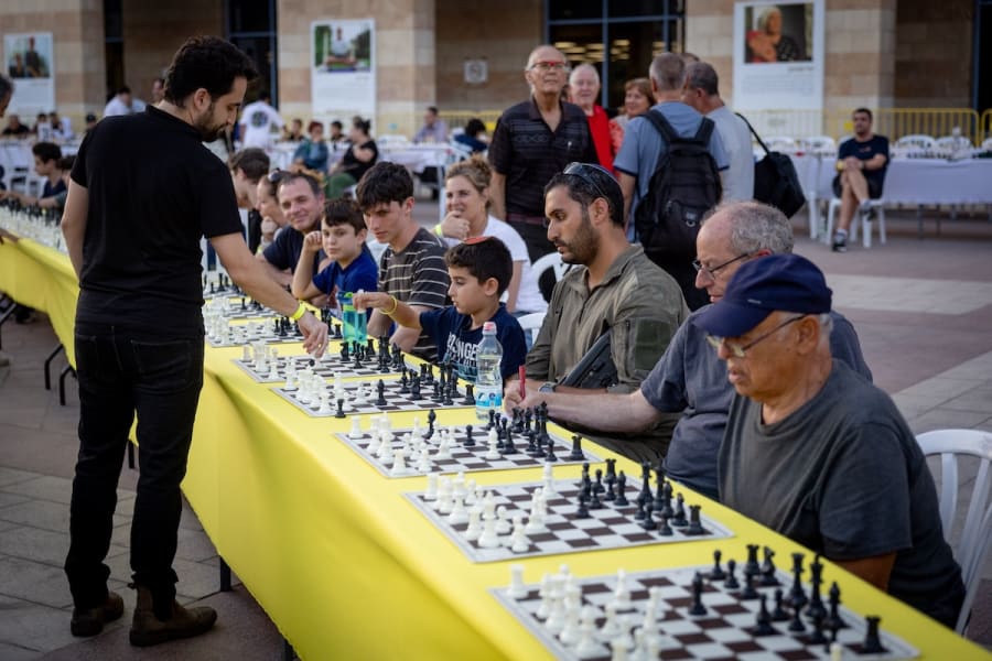 Illustrative - Hundreds of chess players take part in a massive simultaneous chess event, where 1,000 players of all ages compete at the same time, as part of the Jerusalem Masters 2024, at Safra Square in Jerusalem, September 26, 2024. (Photo: Yonatan Sindel/Flash90)