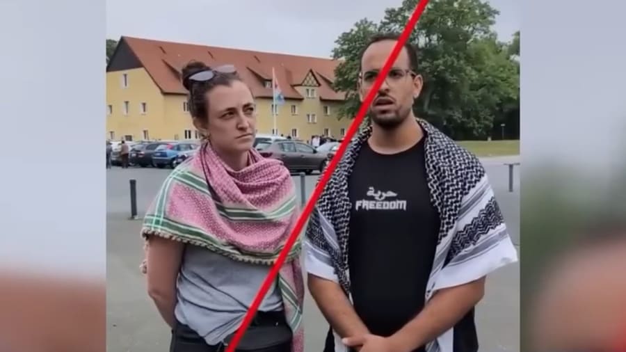 Members of a group wearing keffiyehs who attempted to enter the Buchenwald concentration camp site to protest the Gaza war. (Photo: Screenshot)