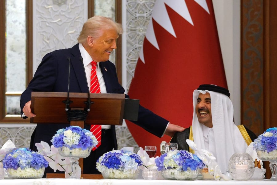 U.S. President Donald Trump speaks next to Qatar's Emir Tamim bin Hamad Al Thani on the day of a state dinner, at Lusail Palace in Lusail, Qatar, May 14, 2025. (Photo: REUTERS/Brian Snyder)