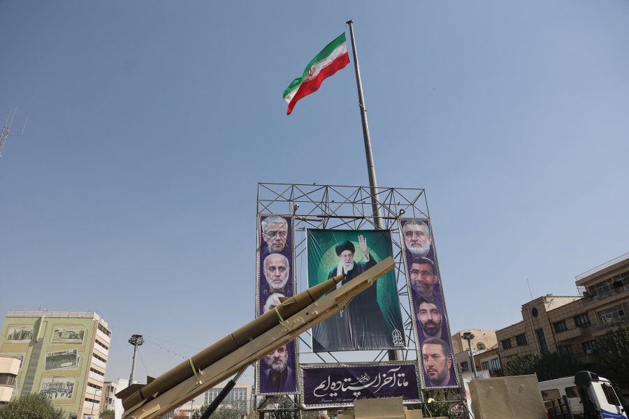 An Iranian missile system is displayed next to a banner with a picture of Iran's Supreme Leader Ayatollah Ali Khamenei during the Iranian Defence Week, Tehran, Iran, September 25, 2025. (Photo: Majid Asgaripour/WANA via Reuters)