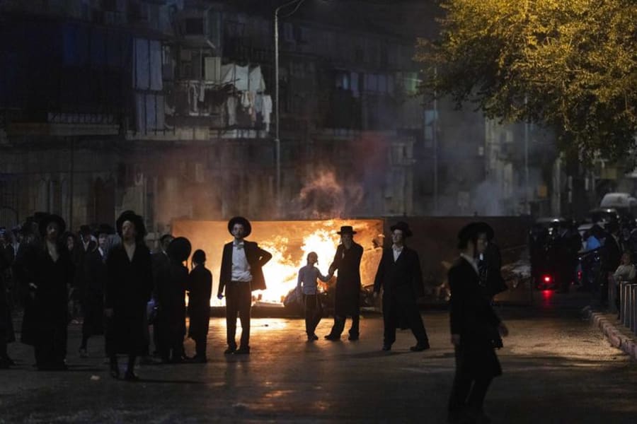 Ultra-Orthodox Jewish men attend a protest against the jailing of yeshiva students who failed to comply with army recruitment orders, in the Mea She’arim neighborhood of Jerusalem, Oct. 22, 2025. (Photo: Chaim Goldberg/Flash90)