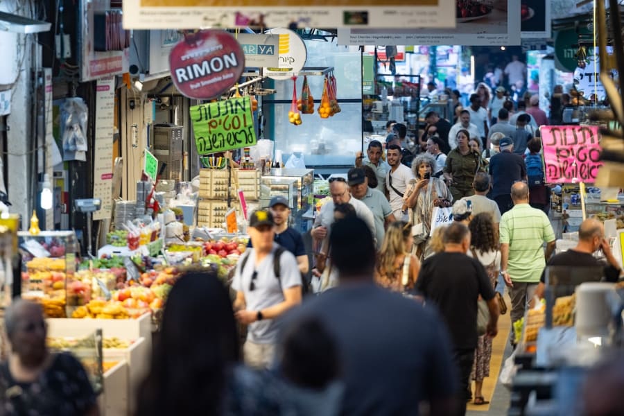 People shop at the Machane Yehuda market in Jerusalem, ahead of Rosh Hashana, the Jewish New Year, September 21, 2025. (Photo: Yonatan Sindel/Flash90)