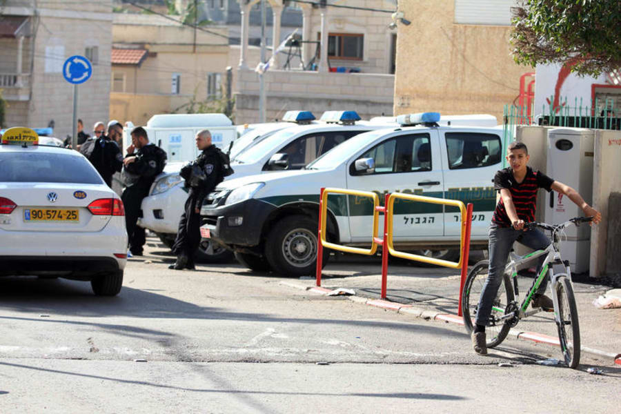 Israeli police seen at the site where a large fight between local Muslim and Druze residents at the Abu Snan village in Northern Israel, November 15, 2014. A scuffle broke out between Arab and Druze residents after a couple of Arab students in a mixed school showed up wearing Kaffiyahs as a sign of protest against the treatment of Arab citizens in Israel. Druze students objected to the gesture and the youth broke into a fight which later spread to other locations in the village, ending up with 41 people injured. Photo by Flash90