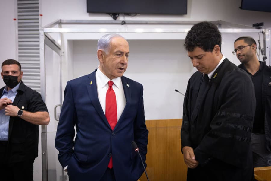 Israeli Prime Minister Benjamin Netanyahu arrives to the courtroom at the District court in Tel Aviv, before the start of his testimony in the trial against him, Oct. 28, 2025. Photo by Miriam Alster/Flash90