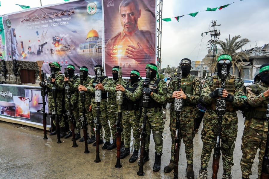 Members of Hamas' Al-Qassam Brigades hand over of Israeli hostages to the Red Cross, as part of the ceasefire agreement between Israel and Hamas, in Rafah, February 22, 2025. (Photo: Abed Rahim Khatib/Flash90)