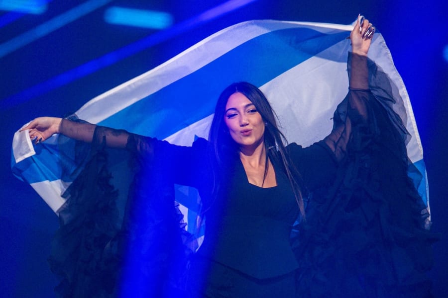 Yuval Raphael from Israel comes on stage with the national flag during a rehearsal for the final show of the 69th Eurovision Song Contest in the Arena St. Jakobshalle. (Photo: Jens Büttner/dpa via Reuters)