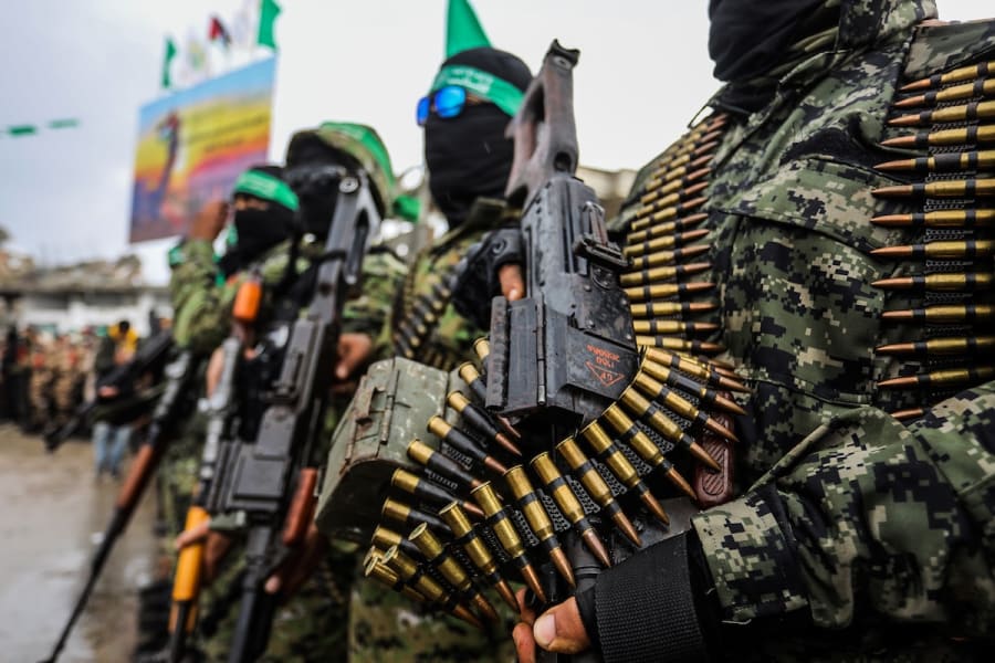 Members of Hamas' Al-Qassam Brigades hand over of Israeli hostages to the Red Cross, as part of the ceasefire agreement between Israel and Hamas, in Rafah, February 22, 2025. (Photo: Abed Rahim Khatib/Flash90)