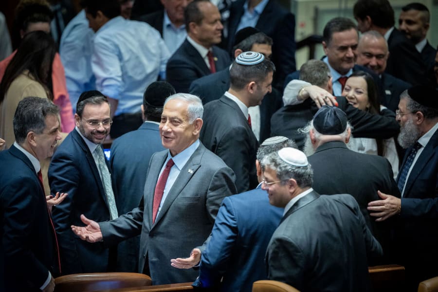Likud Chairman MK Benjamin Netanyahu surrounded by members of Knesset after a vote for the new Knesset speaker, Dec. 13, 2022. (Photo: Yonatan Sindel/Flash90)