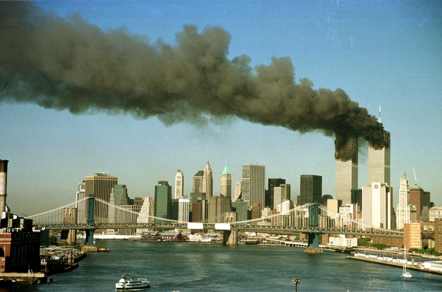 A September 11, 2001 file photo shows the towers of New York's World Trade Center pour smoke shortly after being struck by hijacked commercial aircraft. (photo credit: REUTERS/Brad Rickerby JDP)