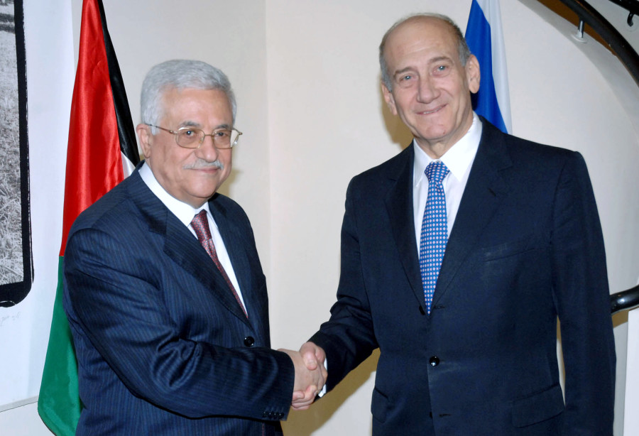 Israel's Prime Minister Ehud Olmert (R) shakes hands with Palestinian President Mahmoud Abbas during their meeting in Jerusalem September 10, 2007, in this picture released by the Israeli Government Press Office (GPO). REUTERS/Moshe Milner/GPO/Handout (JERUSALEM).