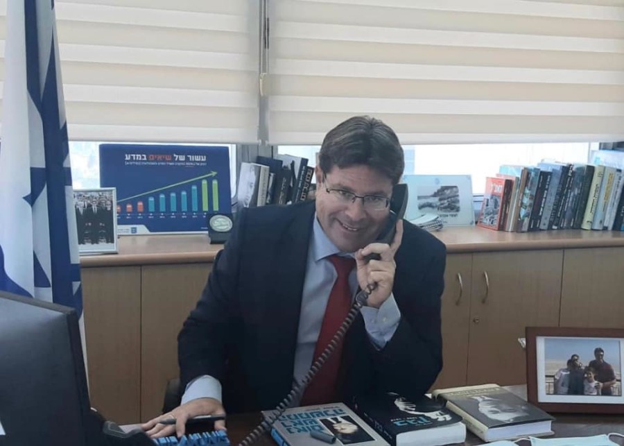 Ofir Akunis, Israel’s minister of Regional Cooperation speaking by phone with Zayed Bin Rashid Alzayani, Bahrain’s Minister of Industry, Commerce and Tourism, Sept. 14, 2020 (Photo credit: Israeli Ministry of Regional Cooperation)