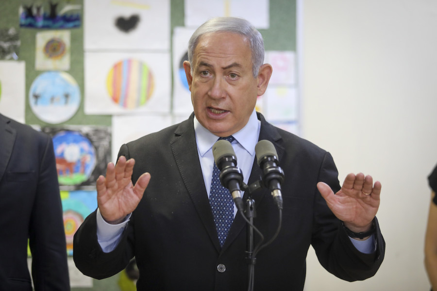 Prime Minister Benjamin Netanyahu, pictured here visiting a Jerusalem school last month, is in the fight of his political life. (Photo credit: Flash90, Marc Israel Sellem/POOL)