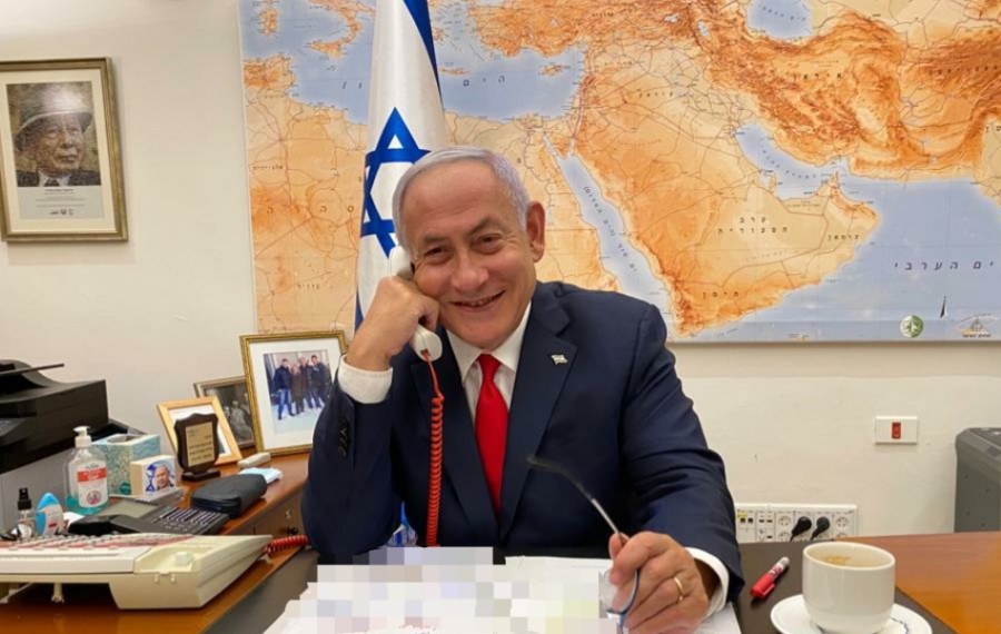PM Netanyahu speaking on the phone (Israel Government Press Office)