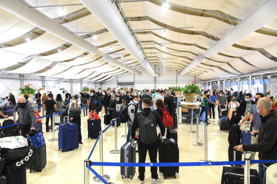 Illustrative - Medical technicians test passengers for COVID-19 at the Ben-Gurion International Airport near Tel Aviv on Mar. 8, 2021. (Photo: Flash90)