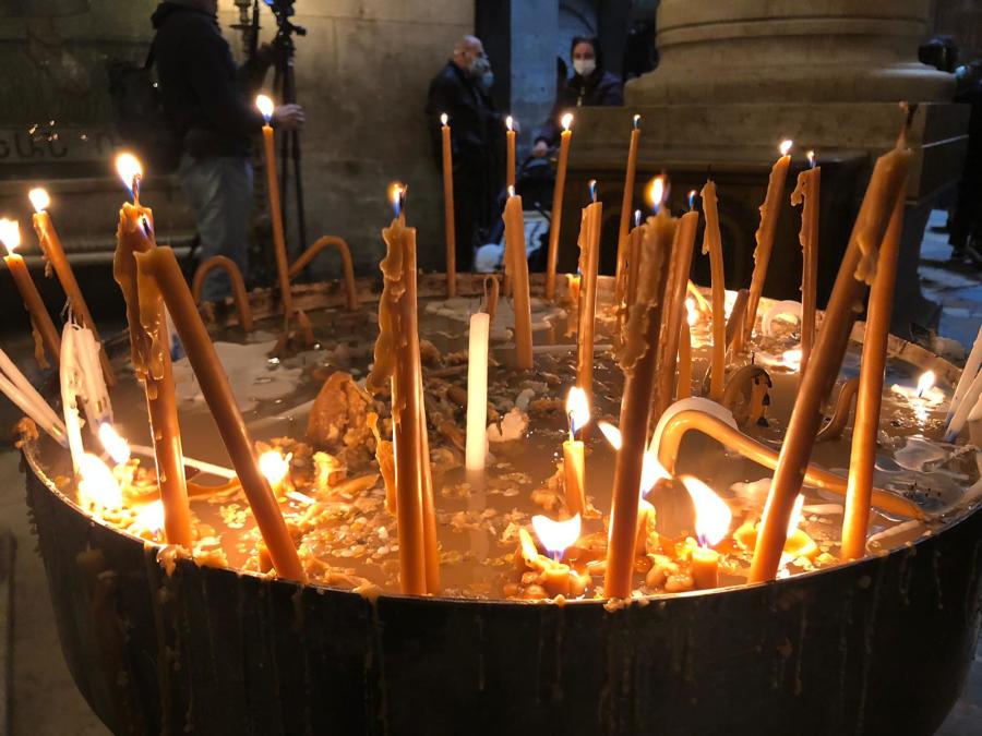 Candles lit for Easter at the Holy Sepulchre in Jerusalem's Old City. (Photo: All Israel News)