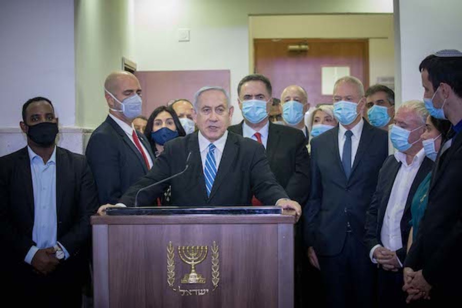Israeli prime minister Benjamin Netanyahu is surrounded by Likud lawmakers as he gives a press statement ahead of the start of his trial at the District Court in Jerusalem, May 24, 2020. (Photo: Yonatan Sindel/Flash90)