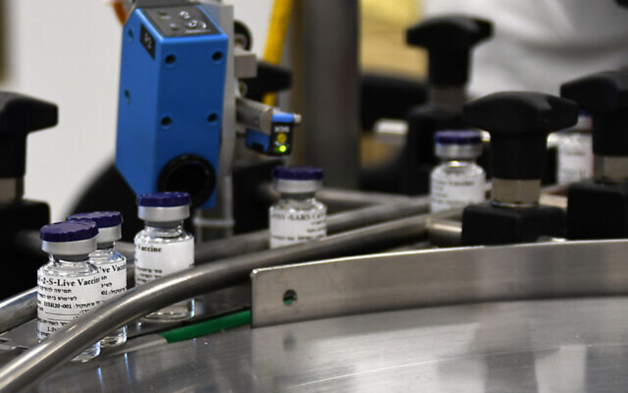 Vials of a potential coronavirus vaccine are seen on an assembly line in a photograph released by Israel's Institute for Biological Research, Oct. 25, 2020. (Photo: Israeli Ministry of Defense)