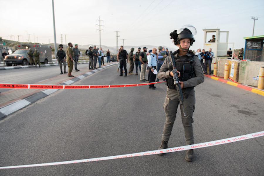 Israeli soldiers and police inspect the scene of shooting attack in Tapuach Junction, south of the West Bank city of Nablus, on May 2, 2021. (Photo: Sraya Diamant/Flash90)