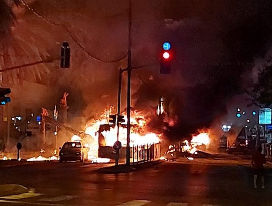 A bus on fire in central Israel after being hit by a rocket from Gaza, May 11, 2021 (Photo: IDF Twitter feed)
