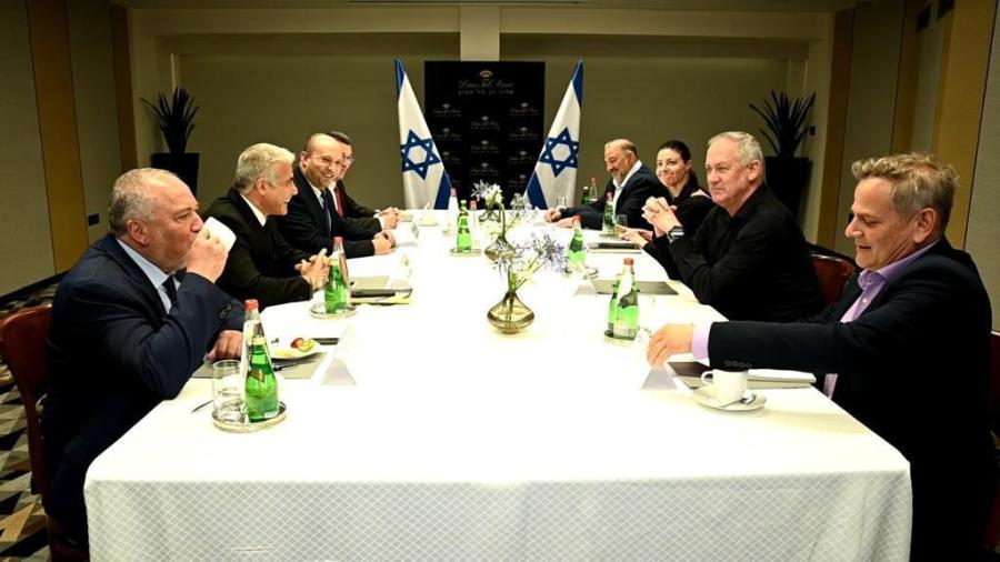 (L-R) Yisrael Beytenu leader Avigdor Liberman, Yesh Atid leader Yair Lapid, Yamina chair Naftali Bennett, New Hope chair Gideon Sa'ar, Blue and White head Benny Gantz, Ra’am chair Mansour Abbas, Labor head Merav Michaeli and Meretz leader Nitzan Horowitz at a meeting of the heads of the would-be-coalition in Tel Aviv, June 6, 2021. (Yesh Atid Twitter feed)