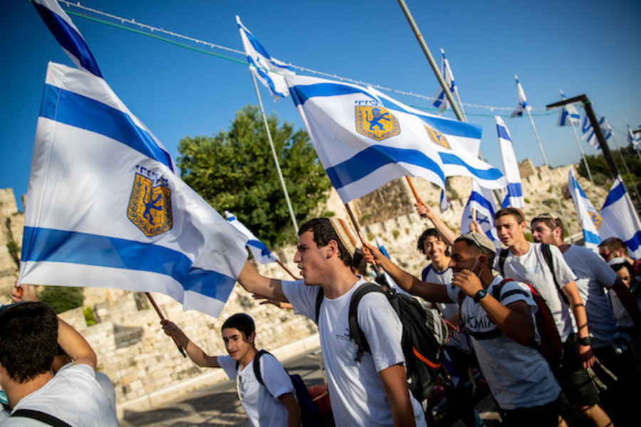 Young Jewish men celebrate Jerusalem day around the Old City walls of Jerusalem, May 21, 2020, Jerusalem Day celebrations mark the 53rd anniversary of its capture of Arab east Jerusalem in the Six Day War of 1967. Photo by Yonatan Sindel/Flash90